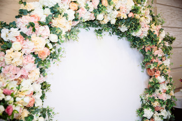 The concept of wedding decor, street decoration, wedding arch is decorated with flowers - pink and...