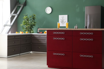 Interior of modern kitchen with stylish furniture