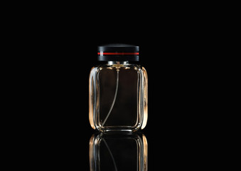 Bottle of perfume on dark background