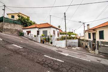 Fototapeta na wymiar July, 2018 - Funchal, Portugal. Funchal street, capital of Madeira Island, cityscape with main street at sunny summer day. Travel concept