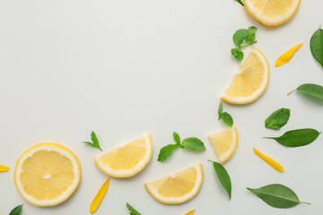 Flat lay composition with lemon slices on white background