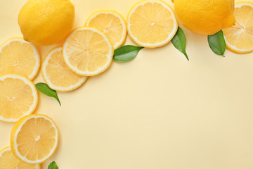Flat lay composition with lemon slices on color background