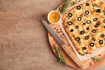 Traditional Italian Focaccia with rosemary on light table