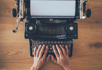 Writer's hands prints on vintage typewriter