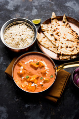 Paneer Butter Masala or Cheese Cottage Curry in serving a bowl or pan, served with or without roti and rice
