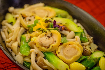 Wok-fried abalone with mixed mushrooms and black truffle paste