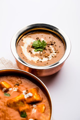 Dal makhani / makhni is a popular dish from India. Made with ingredients like whole black lentil, butter and cream. Served with Naan/roti and rice