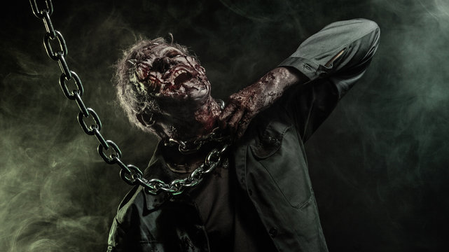 Close-up portrait of a horrible scary zombie man. Horror. Halloween 2018