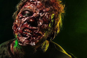 Close-up portrait of a horrible scary zombie man. Horror. Halloween 2018