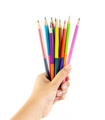 Hand holding colour pencils on isolated white background for kids study and learn art when back school.