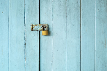 Old Padlock on the Vintage Retro Wood Door