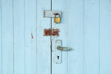 Old Padlock on the Vintage Retro Wood Door