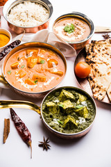 Indian Lunch / Dinner main course food in group includes Paneer Butter Masala, Dal Makhani, Palak Paneer, Roti, Rice etc, Selective focus