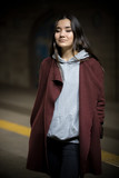 Photo of young woman in night subway