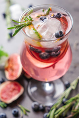 Fresh cocktail in glass on grey table, closeup
