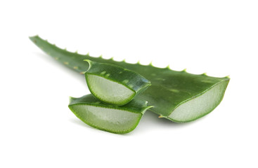 Aloe vera leaf with slices on white background