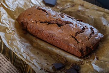 Fresh brownie from the oven on a wooden table
