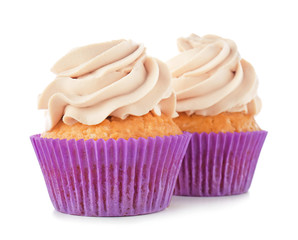 Delicious cupcakes on white background