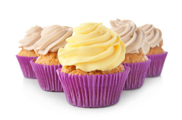 Delicious cupcakes on white background