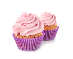Delicious cupcakes on white background
