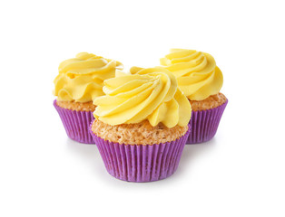 Delicious cupcakes on white background
