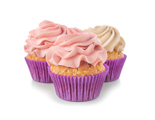 Delicious cupcakes on white background