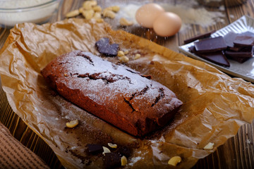 Fresh brownie from the oven on a wooden table