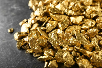 Many gold nuggets on table