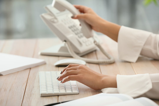 Female Secretary Working In Office