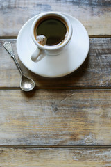 Cup of coffee on brown wooden table
