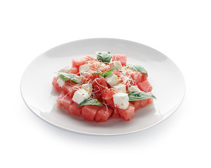 Plate with delicious watermelon salad on white background