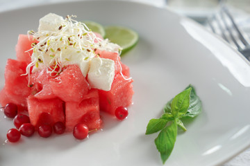 Delicious watermelon salad on plate, closeup