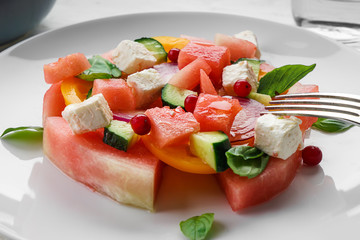 Delicious watermelon salad on plate, closeup