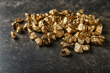 Gold nuggets on black background