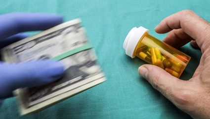 Doctor sells medicine to a sick person in a hospital clandestinely, concept co-payment sanitary