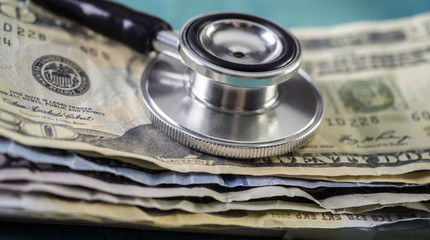 phonendoscope on American tickets, concept of sanitary copayment