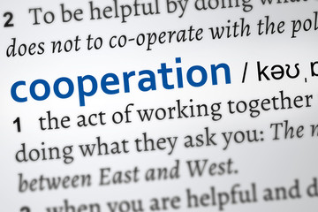 Cooperation dictionary definition, the act of working together