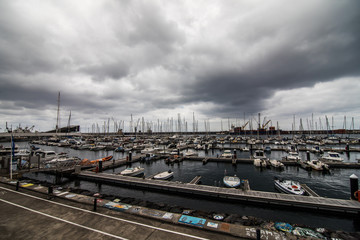 Ponta Delgada, Azores, Portugal - July, 2018: City view with harbor at Ponta Delgada, capital city of the Azores at Sao Miguel Island