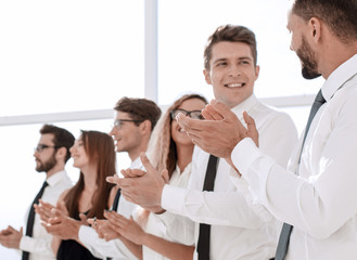 group of young entrepreneurs applauding