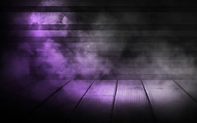 Background of an empty wall, a ray of light in the basement, smoke, neon light. Magic