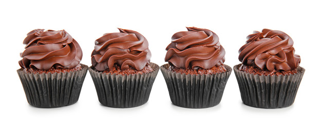 Delicious chocolate cupcakes on white background