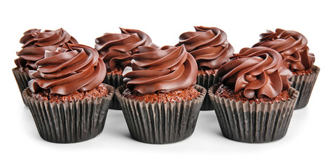 Delicious chocolate cupcakes on white background