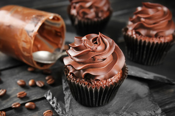 Delicious chocolate cupcake on slate plate