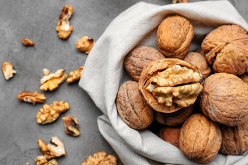 Tasty walnuts on grey table