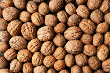 Unpeeled walnuts as background