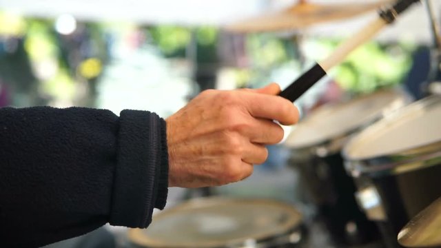 Drumer in action, drummer playing on drum set