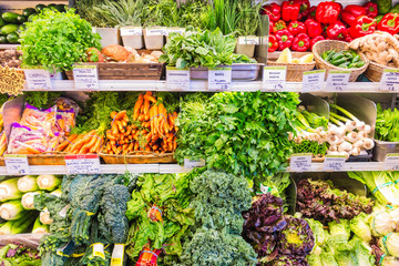 View on containers with various fresh vegetables in the chicago supermarket.