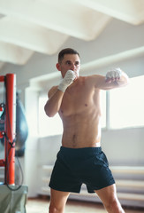 Young fighter training on the ring