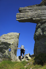 Hiker on the famous Via Alta Verzasca in the Ticino mountains. Switzerland.