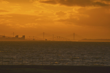 the four bridges in Edinburgh Scotland seen from Prestonpans at down sunset from the harbor travel concept